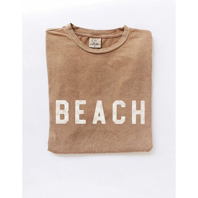 Beach Tee- Toasted Tan
Joanna A. Boutique

The softest mineral washed cotton you’ll ever own, perfect for a beach day, gym run, or lounging + so much more!
